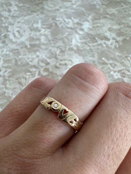 vintage 14k yellow gold "love" ring with diamond accent